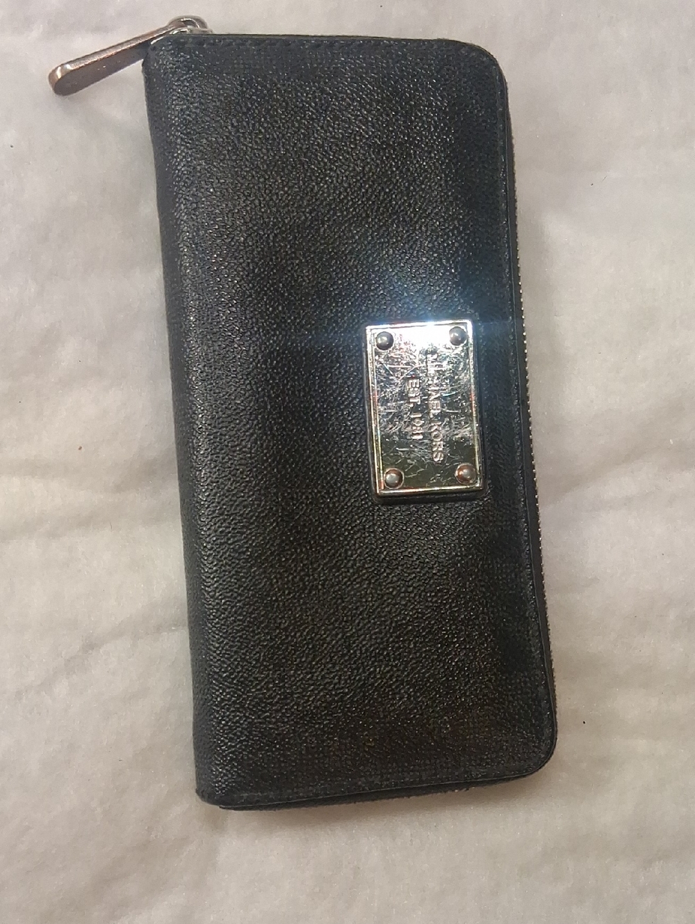 Micheal Kors Black Zip-Around Wallet with Silver Plaque